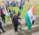 An Indian delegate with the national flag at the 32nd World General Assembly